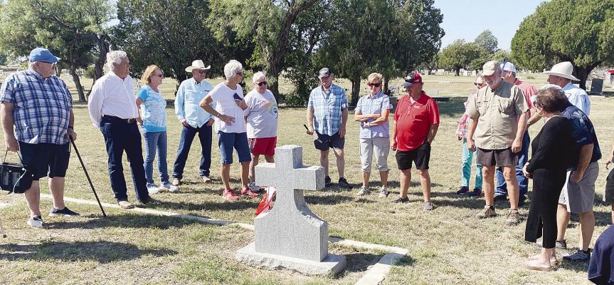 Members of the AHS Class of 1974 gather around the headstone of one of their classmates at the local cemetery, recalling memories of each one in a reunion tradition. They were the “honor class” for the 2024 homecoming, celebrating the 50th anniversary of their graduation. Donnie Lucas / Albany News