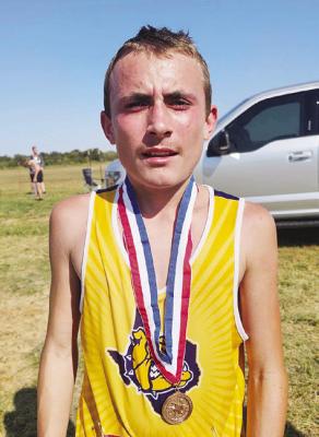 Moran freshman Jason Burge shows his fourth place medal after qualifying for regional. Photo Provided By Moran School