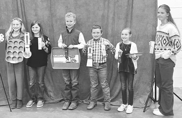 County 4-Hers who placed at last week’s district food show were (l-r) Cameron Burton, Ellie Compton, Truitt Burton, Daxton Lehew, Dally Bezner, Emmie Hise, and (not pictured) Willa Early and Kimberly Howe. Courtesy Photo