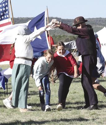 A class of Albany students gets a lesson in frontier square dancing from reenactors at Fort Griffin’s Living History Days last Friday. Even though many districts have gone to a four-day school week, organizers felt that there was good attendance at this year’s event. Melinda Lucas / Albany News