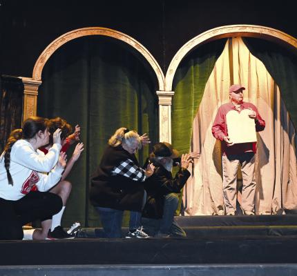 John Tate, portraying Moses in the Albany Nativity, rehearses with members of the Patriarchal Family for this weekend’s performances. Tickets for the biennial production are provided free of charge as a gift to the community, with the Nativity beginning at 7:30 p.m. on both Friday and Saturday nights. DONNIE LUCAS / ALBANY NEWS