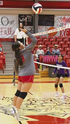 Seventh grader Loralie Balliew gets the hit as the junior high White team comes back to defeat Roscoe Monday night. The local Red team also won over Roscoe, while the Silver squad beat Moran the same night. Donnie Lucas / Albany News