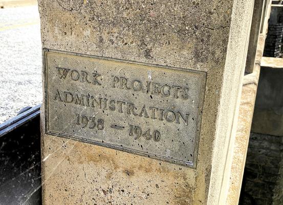 Taken before the bronze plaque was chiseled from its longtime home, this photo shows the bollard at the Deep Creek bridge. County officials are hopeful that the sign was taken with good intent and will be returned. Courtesy Photo