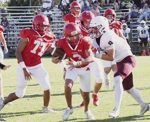 With Adrian Wren (l) moving in to assist, Aiden Vickers (c), keeps the ball to gain a few yards in a match-up against 4ADI Brownwood. The JV will be in Mineral Wells today. Donnie Lucas / Albany News