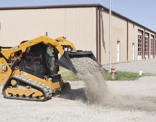 City employee Steve Williamson spreads crushed rock in the parking lot of the Albany Volunteer Fire Department earlier this week. Jamie Nail donated 15 loads of rock to the department for the project. Donnie Lucas / Albany News