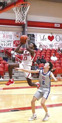 Freshman Jakobi Roberson puts some air between himself and the floor as he goes up for a shot against Graham in a win over Graham on Dec. 5. Albany’s JV won three of their four match-ups in a junior varsity tournament held here last Thursday and Saturday. DONNIE LUCAS / ALBANY NEWS