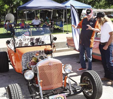 The owner of a rat rod at last weekend’s Albany Classic Car Show talks about his vehicle with another car lover. The event, which was postponed from April 20 because of rain, was held Saturday in downtown Albany. Donnie Lucas / Albany News