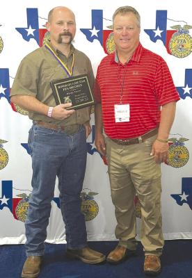 Wesley Turner (l), who traveled to Houston last week along with FFA sponsor Chris Beard (r) and several local chapter members , was the recipient of an Honorary Lone Star FFA Degree. Turner has supported the FFA in multiple ways. Courtesy Photo