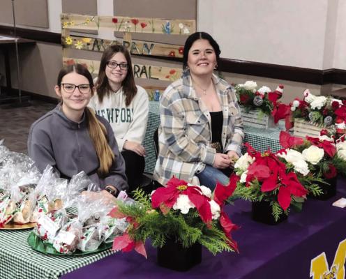 Moran floral design students (l-r) Bradee Stautzenberger, Meaha Martin and Leanna Sikes sell flower arrangements and other Christmas items at Region 14 last week. MISD classes let out today and the spring semester will start Jan. 6. PHOTO PROVIDED BY MORAN SCHOOL