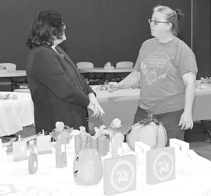 Friendship Baptist members Jana Kitchens (l) and Tanya Petree (r) get some visiting time in during last Saturday’s Harvest Acres. Along with raising funds for missions, the event is also intended to “share fellowship.” Melinda Lucas / Albany News