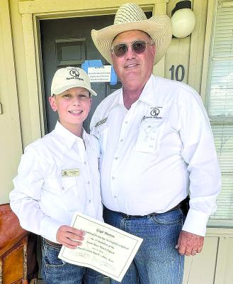 One of the leaders at last week’s Duval County Ranch Brigade, Edward Bordovsky (r) presents Shackelford County resident Gage Burton (l) with his certificate for completing the course. Courtesy Photo