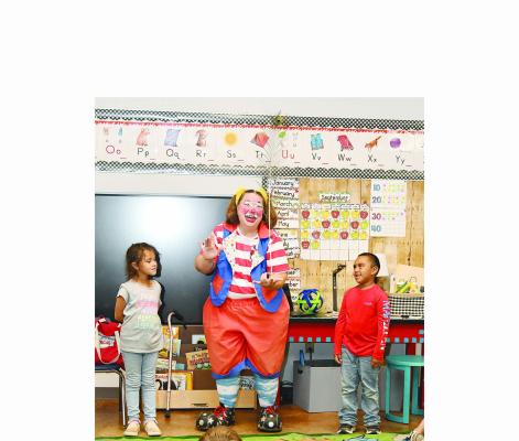 A clown from the Culpepper and Merriweather Circus shows Jesse Castillo (l) and AJ Jaco (r) a balancing trip during a trip to classrooms at Nancy Smith Elementary School earlier this week. The circus will be in town next Tuesday, Oct. 1 on city property just east of town on the Breckenridge highway. Tickets are available from Lions Club members and at several Albany locations. Donnie Lucas / Albany News