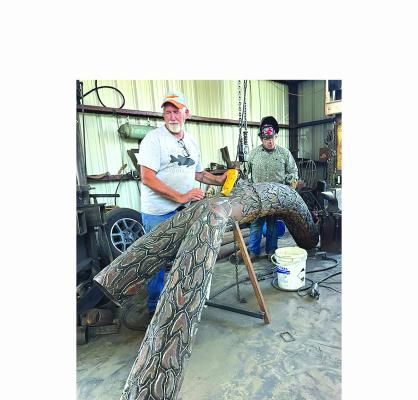 Albany artist Joe Barrington (l), with help from Wesley Estridge (r) continues to work on the details of a pecan branch that will be unveiled during a ceremony Oct. 12 on the Courthouse Square. The piece was commmissioned as part of the Shackelford County sesquicentennial. Courtesy Photo
